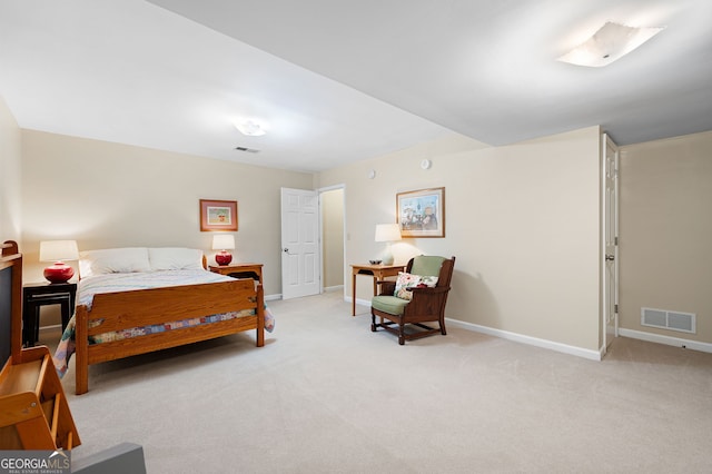 bedroom featuring light colored carpet