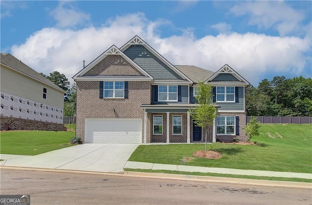 craftsman house with a garage and a front lawn