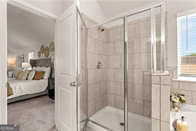 bathroom with an enclosed shower and vaulted ceiling