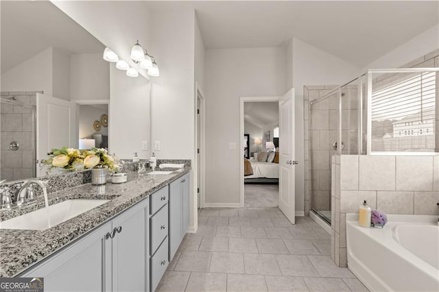 bathroom with tile patterned flooring, vanity, and plus walk in shower