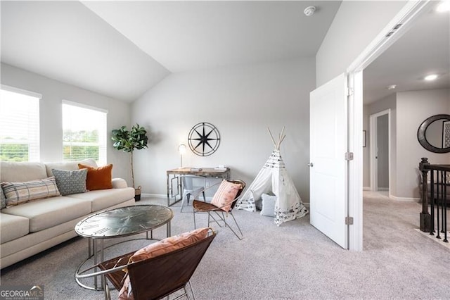 living room featuring vaulted ceiling and light colored carpet