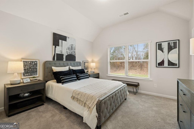 carpeted bedroom featuring vaulted ceiling