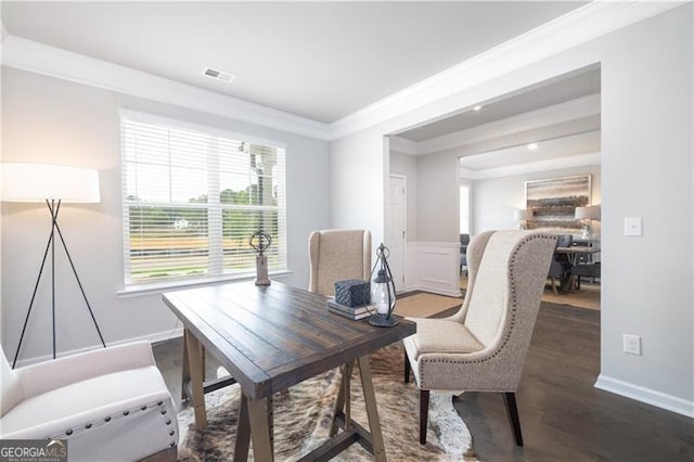 home office with dark wood-type flooring and ornamental molding