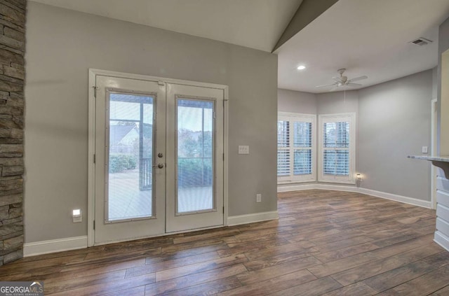 doorway to outside with lofted ceiling, dark hardwood / wood-style floors, french doors, and ceiling fan