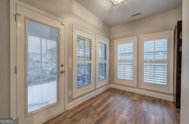 doorway featuring dark wood-type flooring