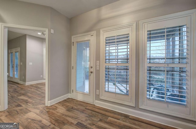 doorway to outside with dark hardwood / wood-style floors