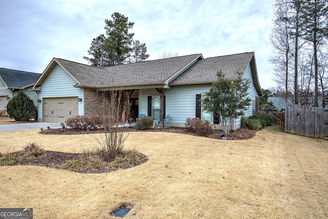 ranch-style house with a garage and a front lawn