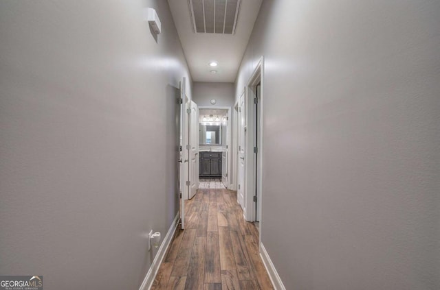 hallway featuring dark hardwood / wood-style floors