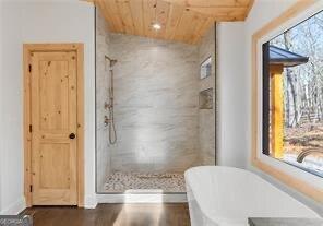 bathroom with wood ceiling, plus walk in shower, and vaulted ceiling