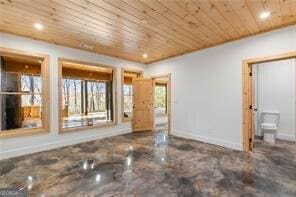 unfurnished living room with wood ceiling