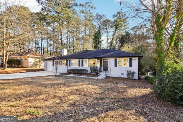 ranch-style home featuring a garage