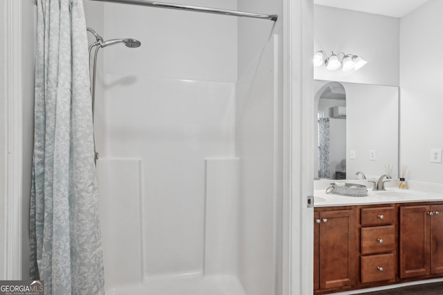 bathroom with vanity, a wall mounted air conditioner, and curtained shower