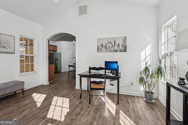 office featuring dark wood-type flooring and high vaulted ceiling