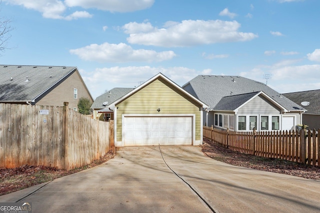 rear view of property featuring a garage