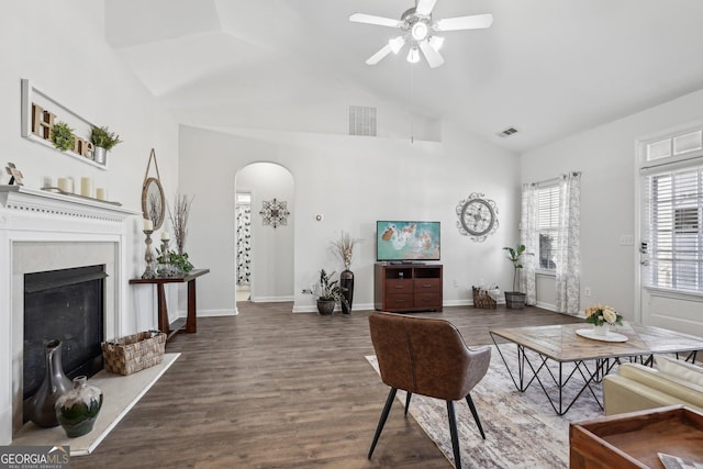 living room with high vaulted ceiling, dark wood-type flooring, and ceiling fan