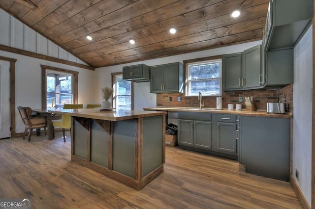 kitchen with wood-type flooring, wooden counters, wood ceiling, and decorative backsplash