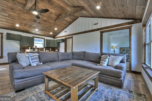 living room featuring ceiling fan, wood-type flooring, vaulted ceiling, and wooden ceiling