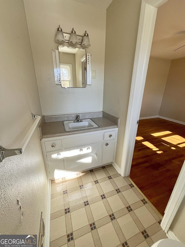 bathroom featuring vanity and hardwood / wood-style floors