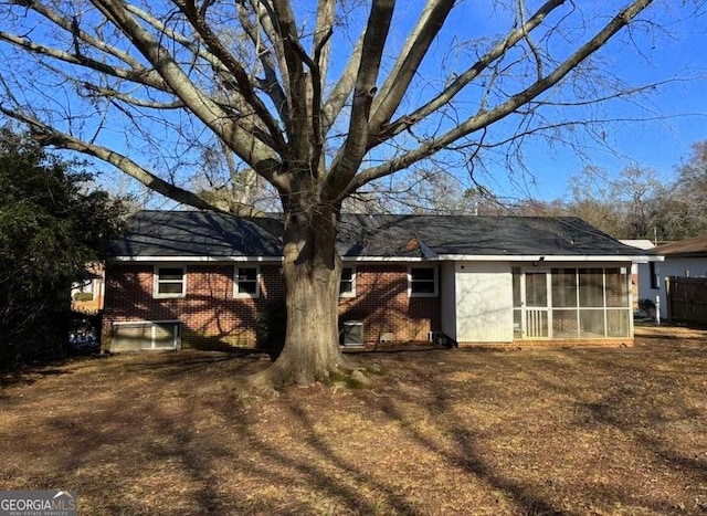 back of house with a sunroom