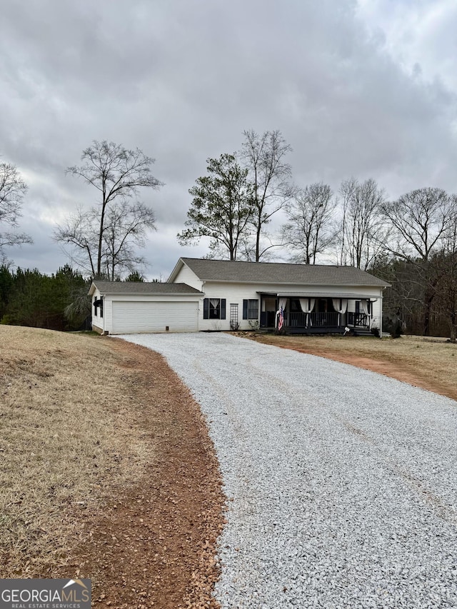 ranch-style home featuring a garage