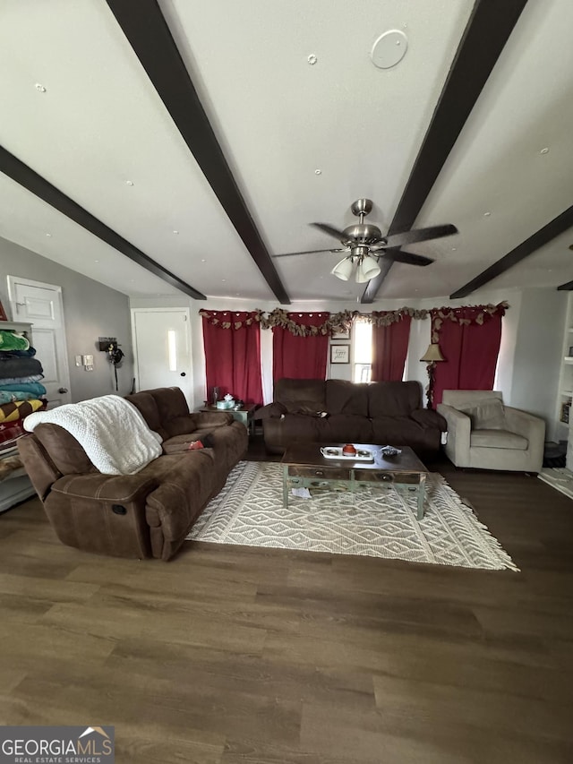 living room with hardwood / wood-style flooring, ceiling fan, and beam ceiling