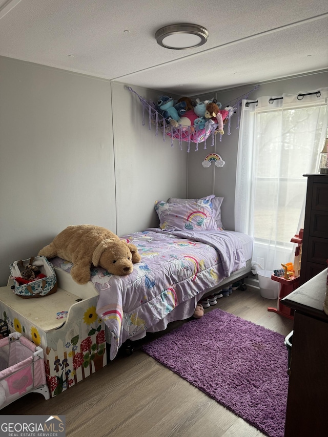 bedroom featuring light hardwood / wood-style floors