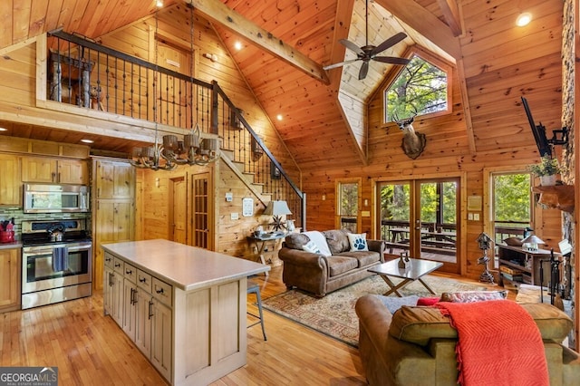 living room with beam ceiling, wooden walls, high vaulted ceiling, and light hardwood / wood-style floors