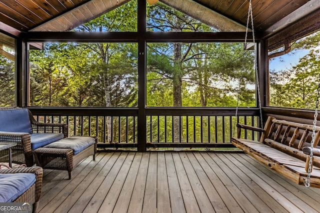 sunroom / solarium featuring wood ceiling and vaulted ceiling