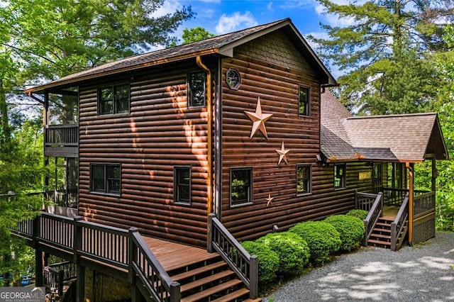 view of property exterior with a deck