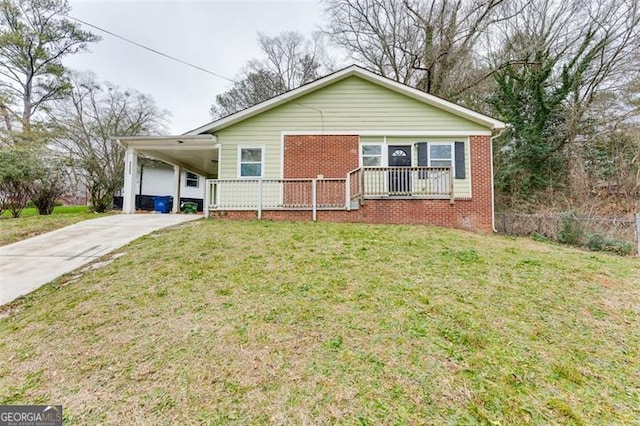 single story home featuring a carport, a porch, and a front lawn