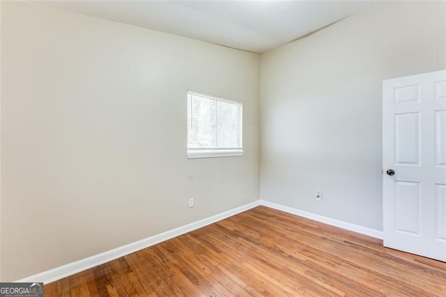 spare room featuring light hardwood / wood-style flooring