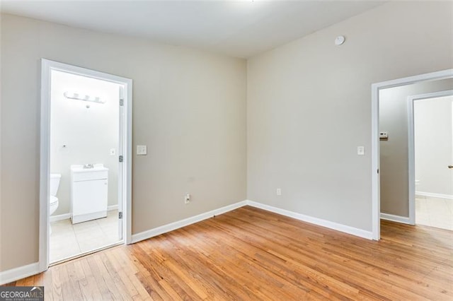 unfurnished room with light hardwood / wood-style flooring