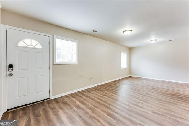 foyer entrance with hardwood / wood-style floors