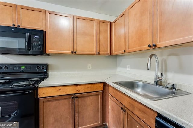 kitchen featuring sink and black appliances