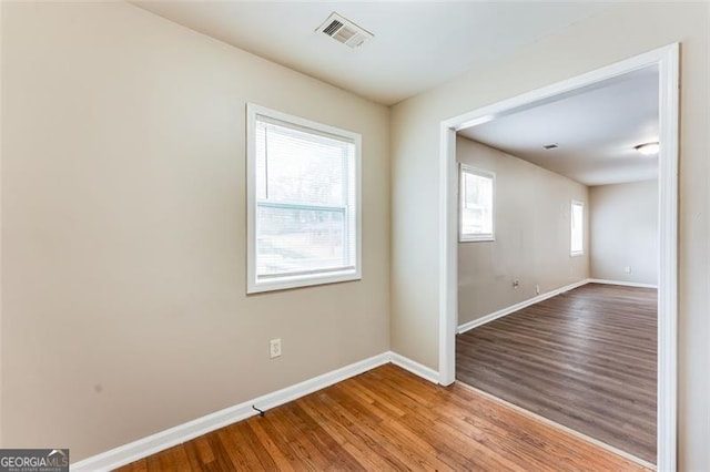 spare room featuring light hardwood / wood-style floors