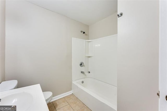 full bathroom with tile patterned floors, toilet, bathing tub / shower combination, and sink