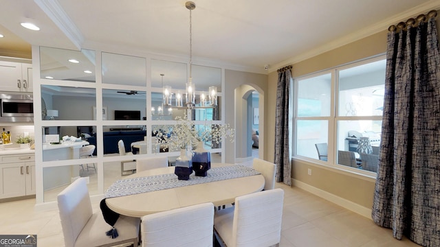 dining area with arched walkways, light tile patterned flooring, crown molding, and recessed lighting