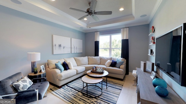 living room with ornamental molding, recessed lighting, a raised ceiling, and ceiling fan