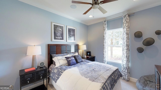 bedroom with multiple windows, crown molding, light colored carpet, and ceiling fan