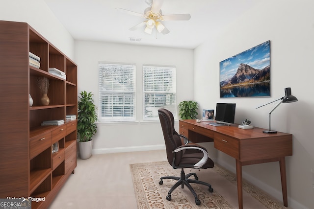 home office with light colored carpet and ceiling fan