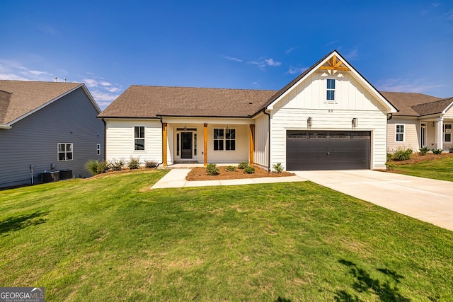 modern farmhouse with a garage, covered porch, a front yard, and central air condition unit