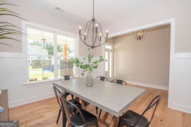 69 Oakhurst Trl, Sharpsburg, GA 30277 - dining room featuring a chandelier and light wood-style floors