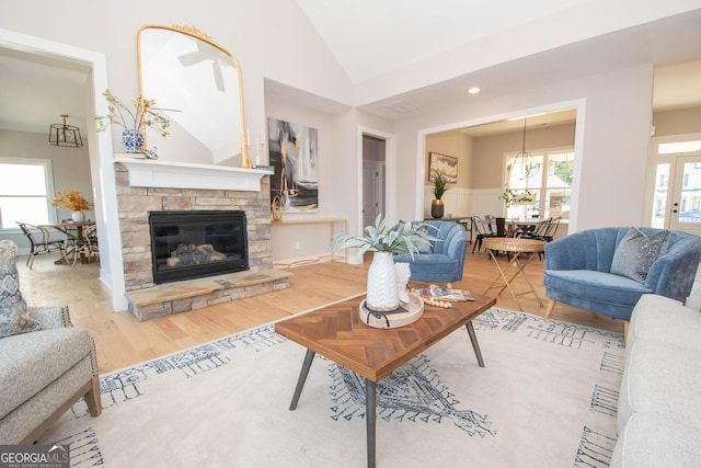 69 Oakhurst Trl, Sharpsburg, GA 30277 - living area with vaulted ceiling, wood finished floors, and a fireplace
