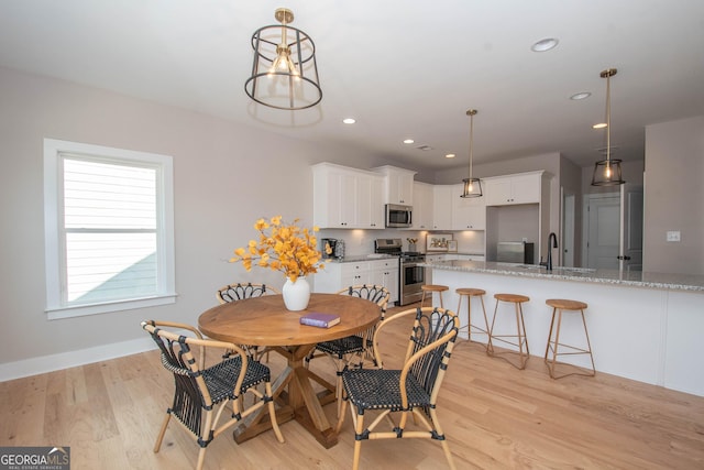 69 Oakhurst Trl, Sharpsburg, GA 30277 - dining area featuring light wood-style floors and recessed lighting