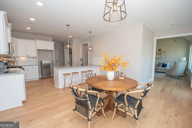 69 Oakhurst Trl, Sharpsburg, GA 30277 - dining area featuring light wood-style flooring and recessed lighting