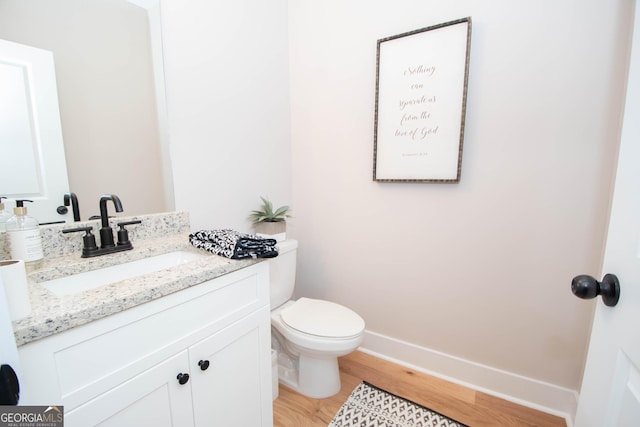 69 Oakhurst Trl, Sharpsburg, GA 30277 - half bath with vanity and wood finished floors