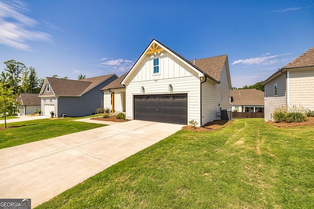 69 Oakhurst Trl, Sharpsburg, GA 30277 - view of front of property featuring board and batten siding, a garage, and concrete driveway