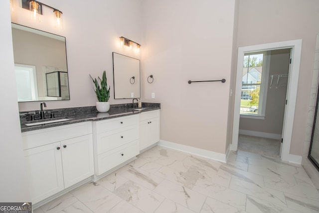 69 Oakhurst Trl, Sharpsburg, GA 30277 - bathroom with double vanity, marble finish floors, and a shower with door