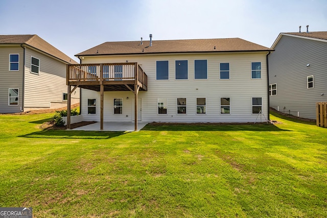 69 Oakhurst Trl, Sharpsburg, GA 30277 - rear view of house with a patio, a lawn, and a deck