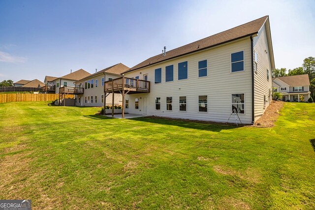 69 Oakhurst Trl, Sharpsburg, GA 30277 - rear view of property with a wooden deck and a patio area